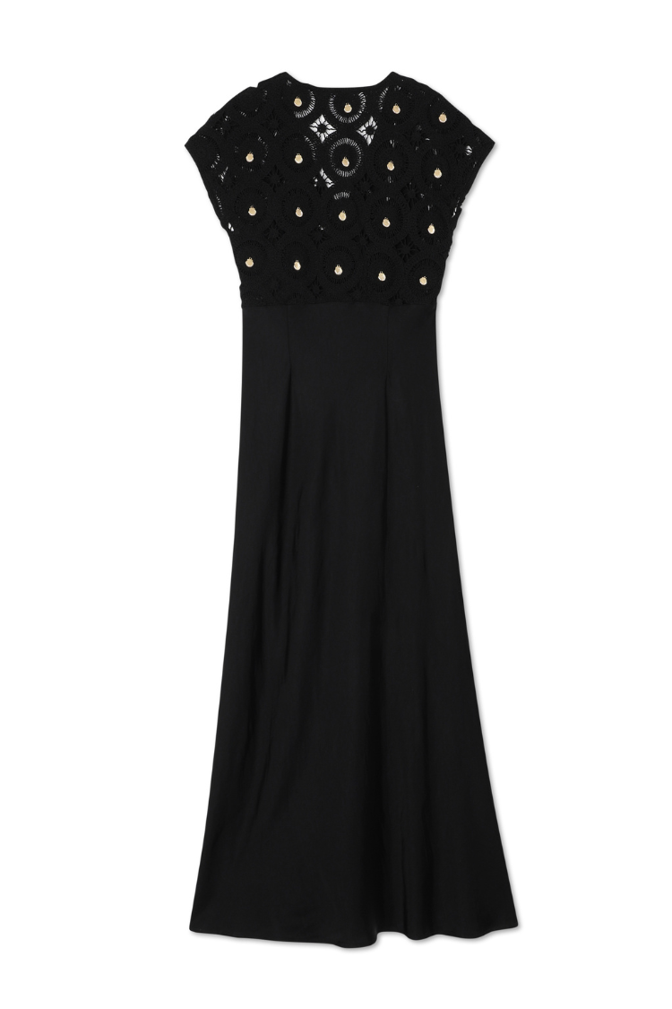Black Elodie Dress featuring a crochet bodice with gold shell embellishments and a flowing, sleek skirt.