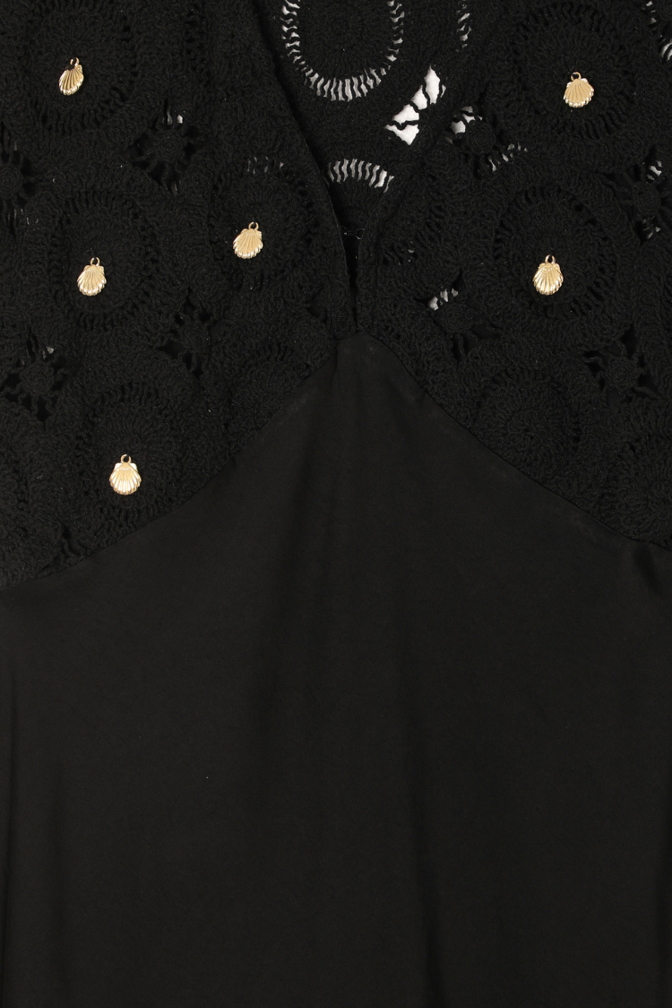 Black Crochet Shell Elodie Dress detail featuring gold shell charms on a crochet bodice and satin fabric.