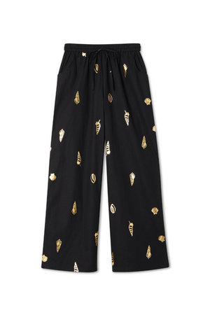 Black Shell Elissa Trousers with a gold metallic shell print, wide-leg silhouette and elasticated drawstring waist.