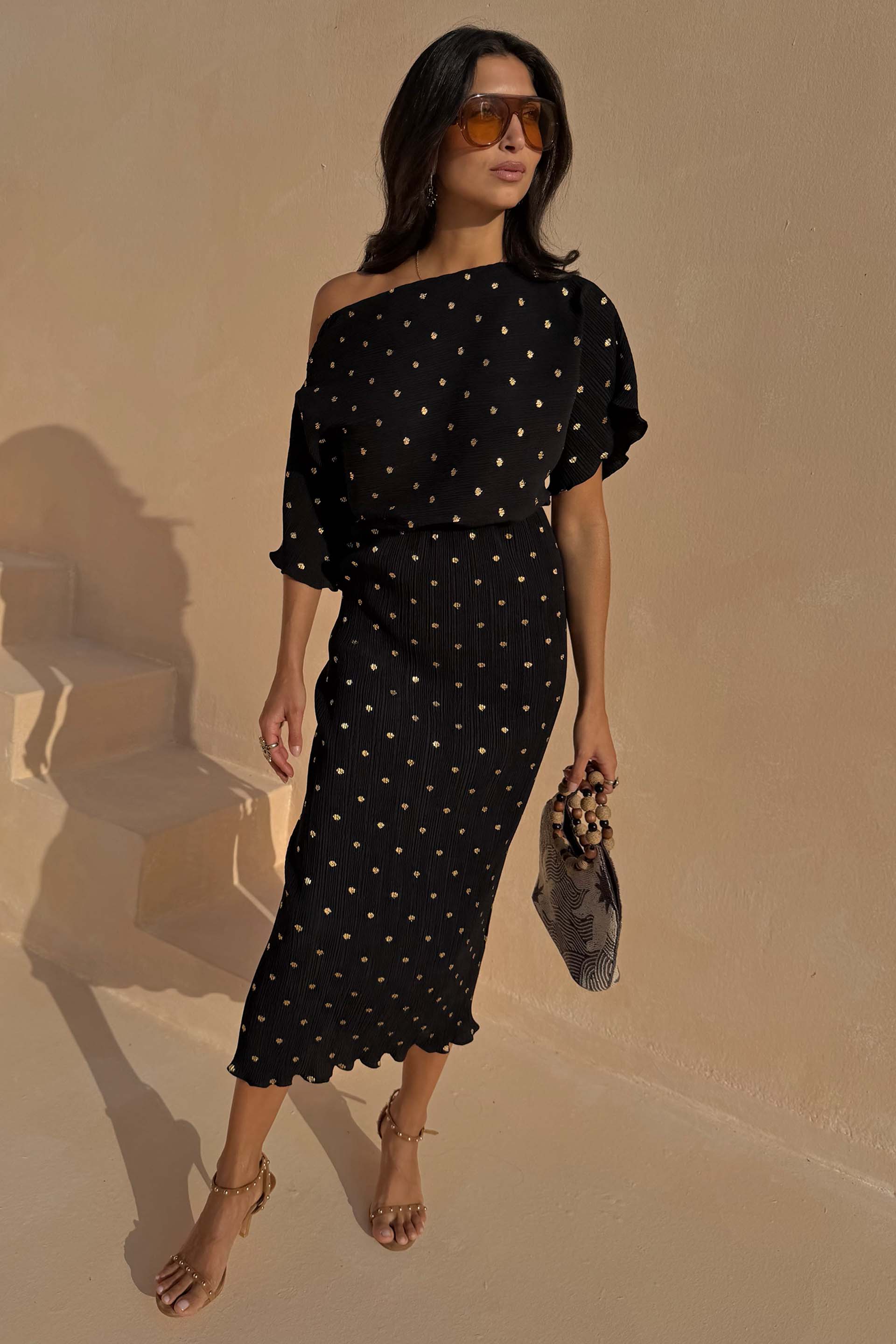 slim fit dress slacks Devina Black And Gold Foil Shirred Cuff Wrap Midi Dress main image 0