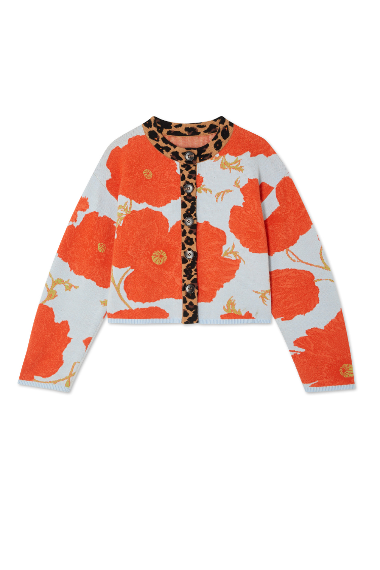 Blue Poppy Cardigan in pale blue knit with orange poppy motifs and leopard print collar and button stand.
