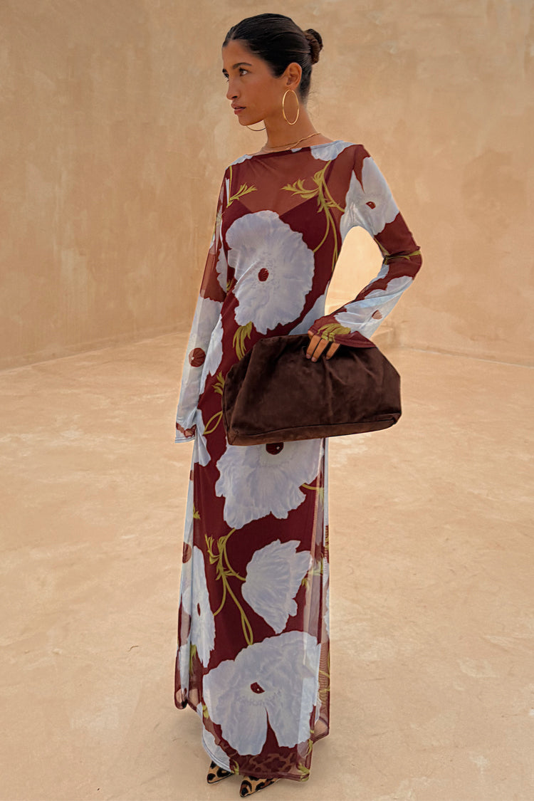 Burgundy and Blue Poppy Aria Dress with a poppy print on sheer mesh, styled with a large brown clutch.