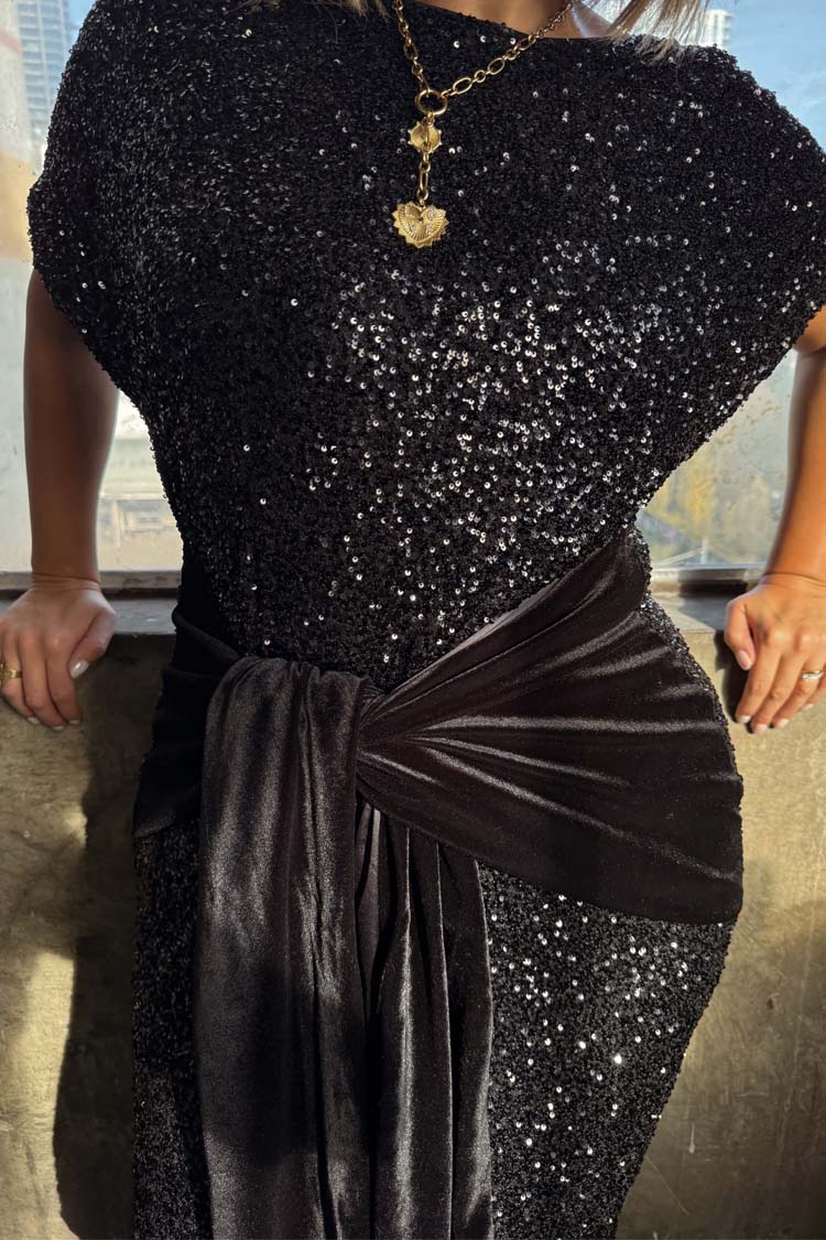 Black Sequin Bow Dress with shimmering sequins and a black velvet waist tie for versatile multi-wear styling.