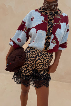Burgundy & Blue Poppy Cardigan with leopard trim, paired with a leopard print lace-trimmed skirt.
