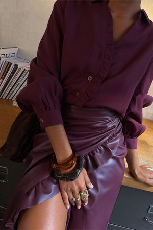 Burgundy Vegan Leather Ruffle Jaspre Skirt and matching ruffle shirt with chunky statement accessories.