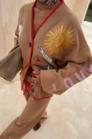 Camel Wide Leg Joggers and matching sun embroidered Mystical Cardigan with red trim on a 5ft4” model, waistband folded.