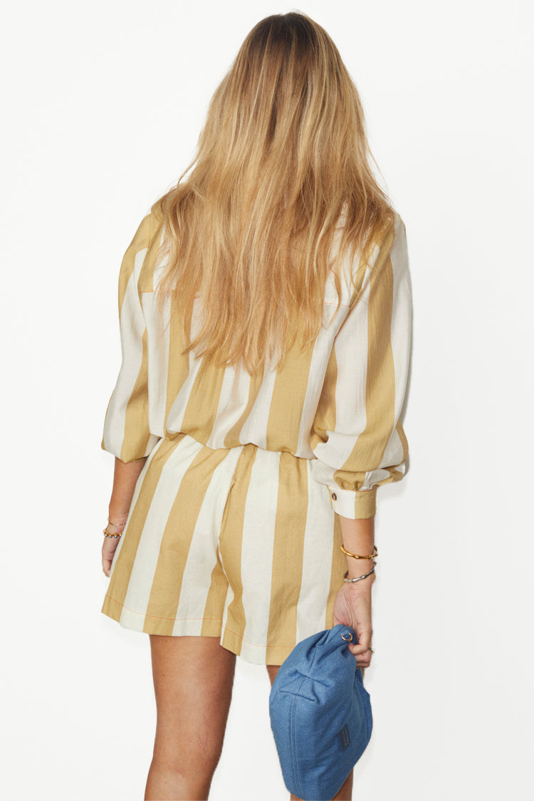 caption_Model wears Camel Stripe Elissa Shorts in UK size 10/ US 6