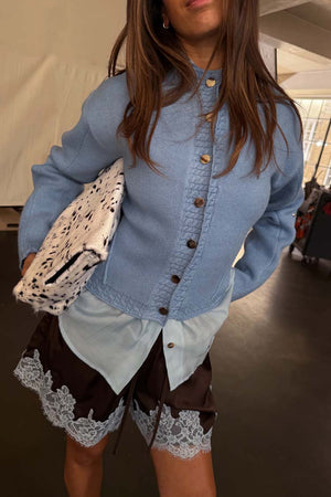Ice Blue Studded Cardigan with silver buttons, styled with a light blue shirt and lace-trim shorts.