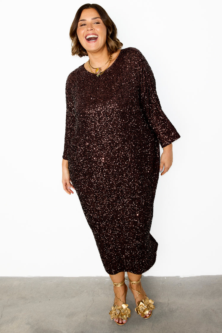 caption_Model wears Chocolate Sequin Jem Dress in UK size 18/ US 14