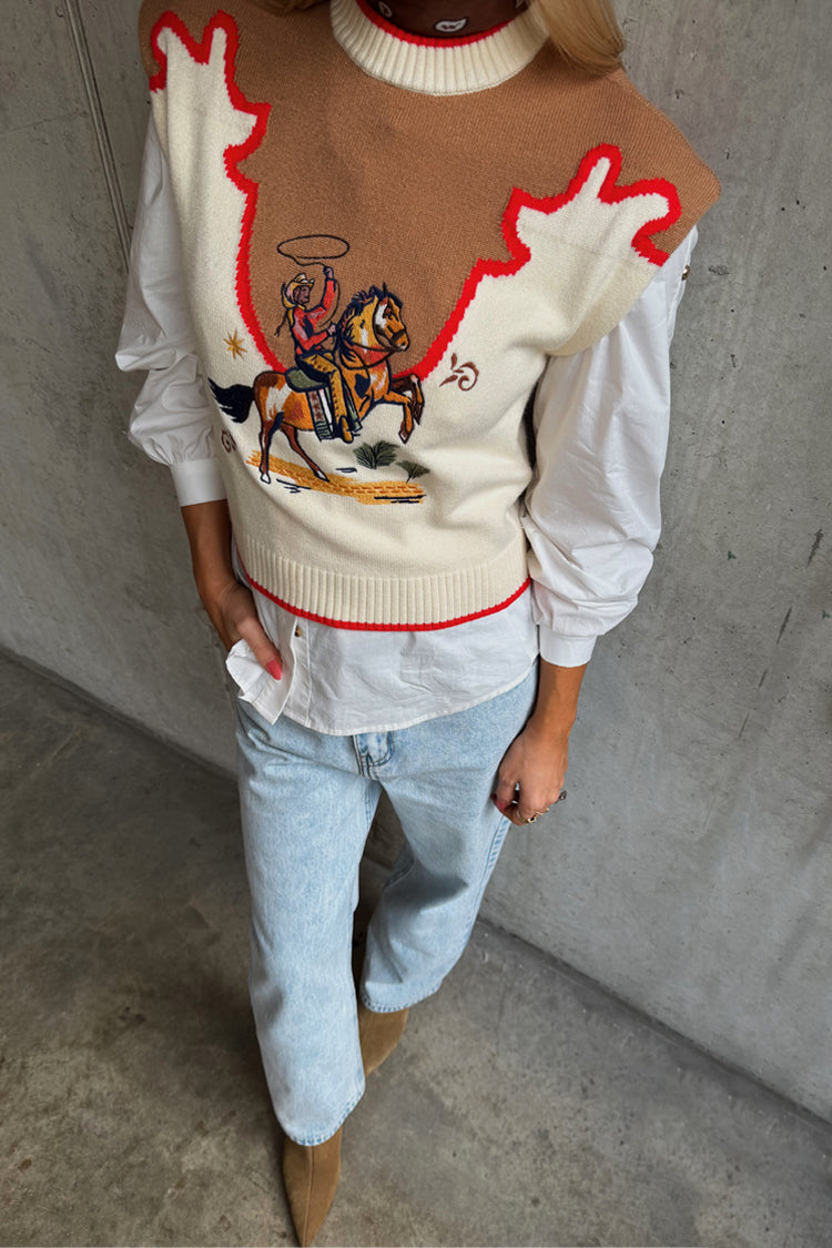 Cowgirl Ro Knitted Tank in cream with a tan western yoke, red contrast stitching and an embroidered cowgirl motif.
