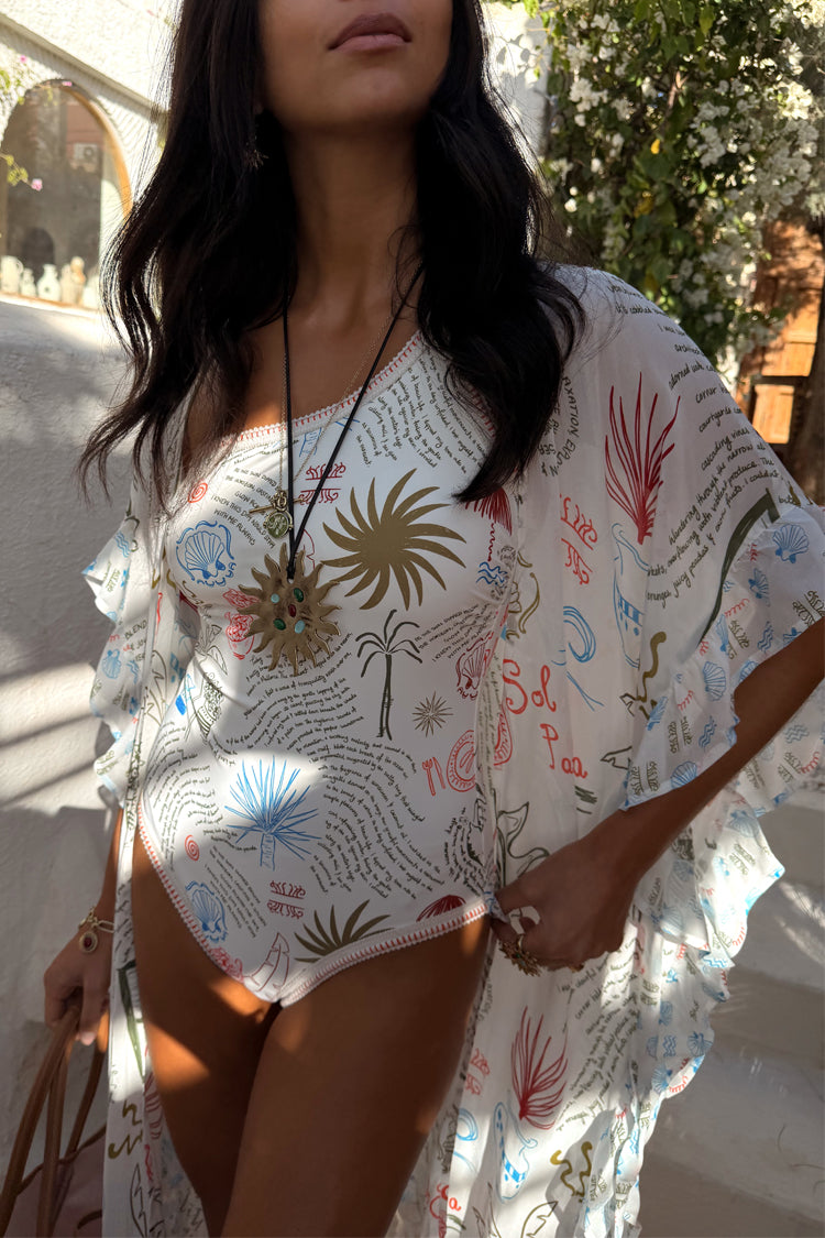 Kimono Cream Palma con stampa grafica su costume coordinato; la modella è alta 170 cm e indossa la taglia M.