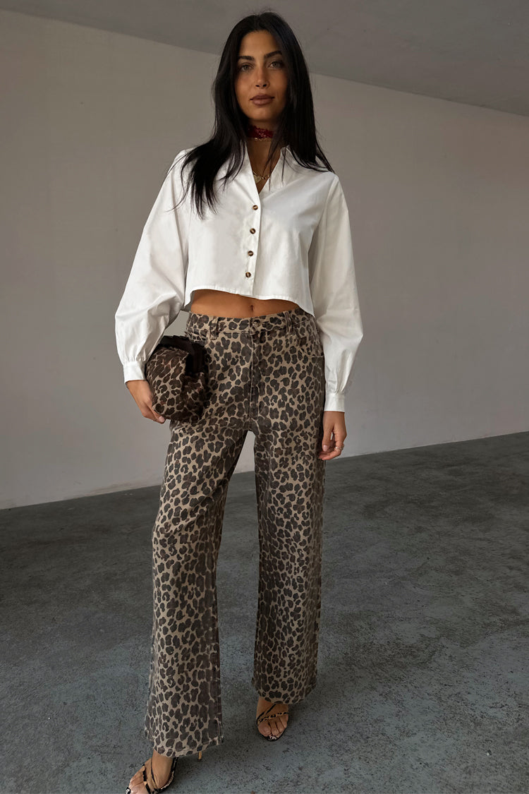 White Cropped Cotton Miley Shirt with tortoise buttons and blouson sleeves, styled with leopard print trousers.