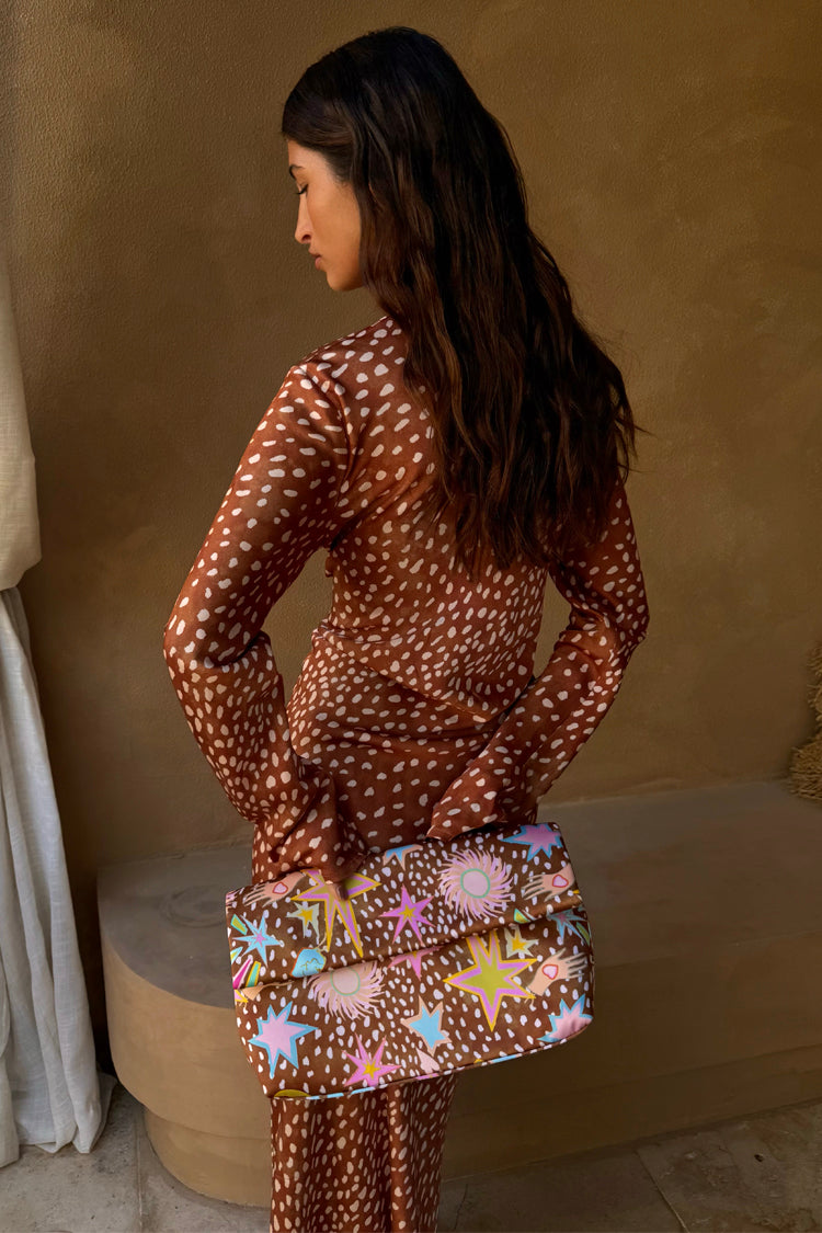Fawn Soho Dress in brown satin with a spotted deer print and flared sleeves, shown from the back.