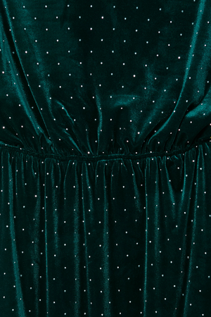 Emerald Velvet Tilly Dress detail showcasing the gathered waist and silver dot pattern on green velvet fabric.