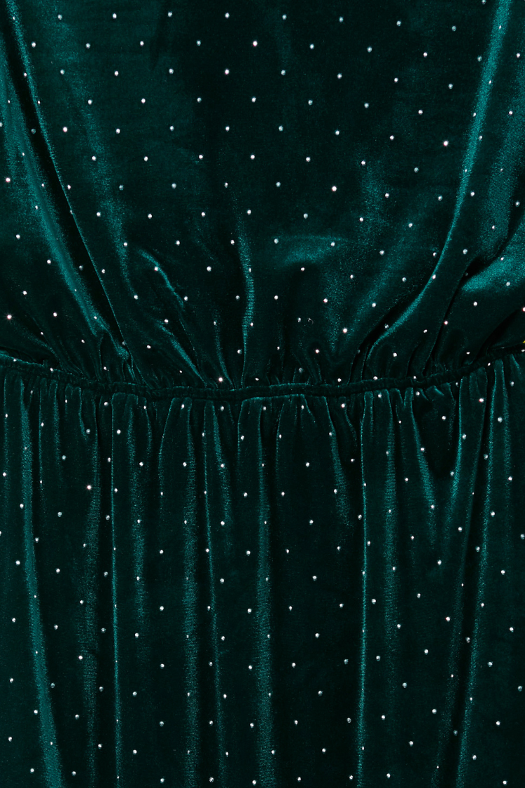 Emerald Velvet Tilly Dress detail showcasing the gathered waist and silver dot pattern on green velvet fabric.