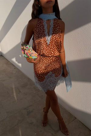 Fawn print Mini Maeva Skirt with light blue lace trim, styled with a matching top and beaded clutch bag.