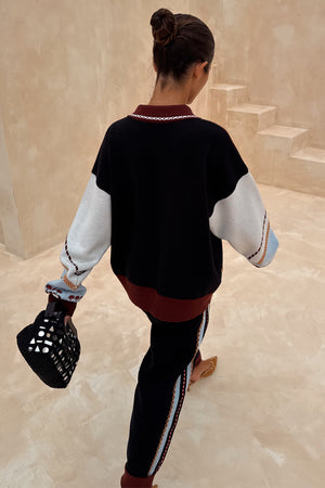 Geometric Knit Cardigan with palm motif embroidery and blanket stitch trim, paired with joggers.