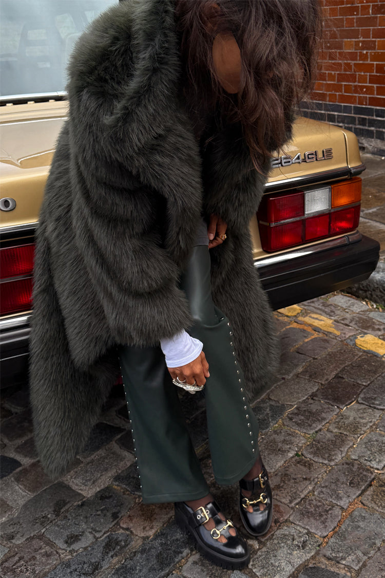 Green Faux Fur Coat in a relaxed silhouette, styled as a statement staple for a London street look.