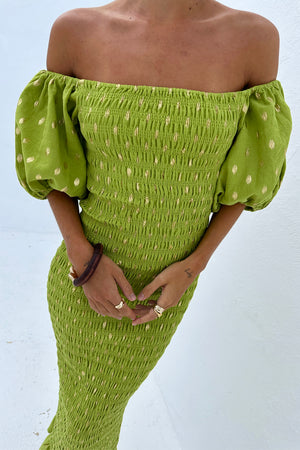 Olive Jojo Dress featuring gold flecks, a shirred bodice and puffed off-the-shoulder sleeves.