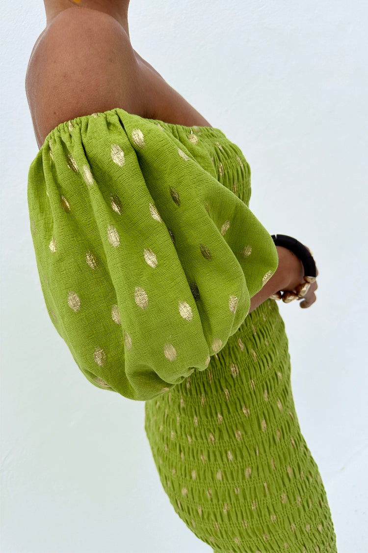 Olive Jojo Dress with gold flecks, featuring a shirred bodice and off-the-shoulder puffed sleeves.