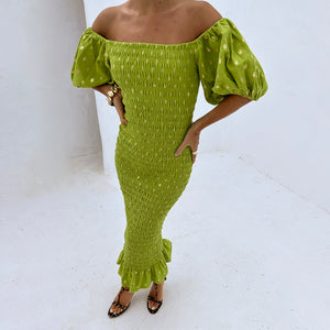 Olive Jojo Dress with gold fleck print, styled off-the-shoulder with puff sleeves, a shirred bodice and frill hem.