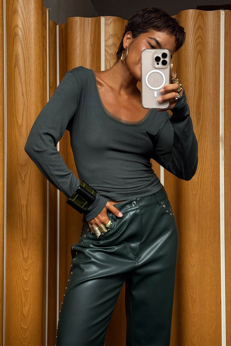 Green Long Sleeve Teddy T-Shirt with a mesh neckline, styled with studded leather-look trousers.