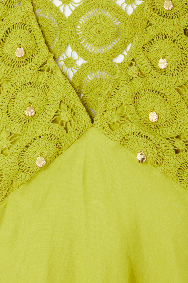 Green Shell Mini Elodie Dress detail featuring lime crochet knit, satin, and gold shell charms.