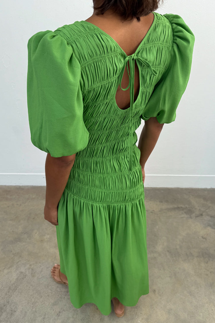 Green Shirred Nara Dress with a multi-wear tie-neck, puffed sleeves and shirring, designed in London.