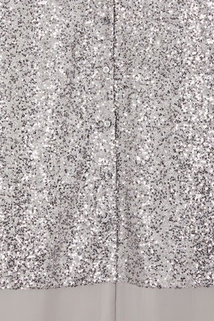 Shimmering gunmetal silver sequins and button-up front detail on the Lila Shirt Dress.