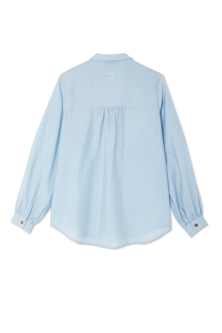 Sky blue Ice Blue Miley Shirt featuring blouson sleeves and embroidered logo on the back neck.