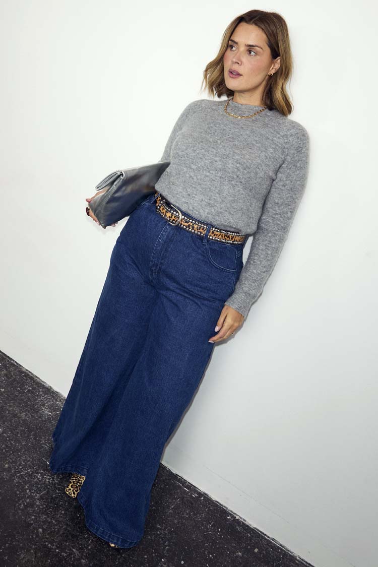 Blue Denim Pallazzo Jan Jean with a wide-leg fit, styled with a grey knit and leopard print belt on a size 18 model.