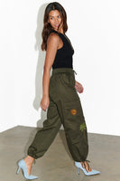 Thumbnail for caption_Model wears Khaki Running Wild Cargo Trousers in UK size 8/ US 4
