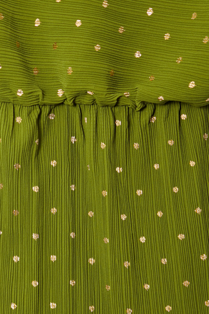Khaki Mini Plisse Tilly Dress detail highlighting the textured green fabric, gold fleck print and elasticated waist.