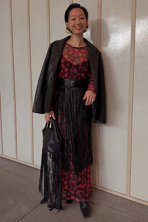 Black Leather Blazer in a relaxed fit, a transeasonal investment piece styled over a cherry print dress with fringe.