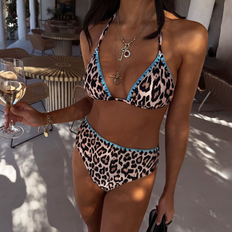 Leopard print high waist bikini bottom with contrast blue whipstitch detailing and matching bikini top.