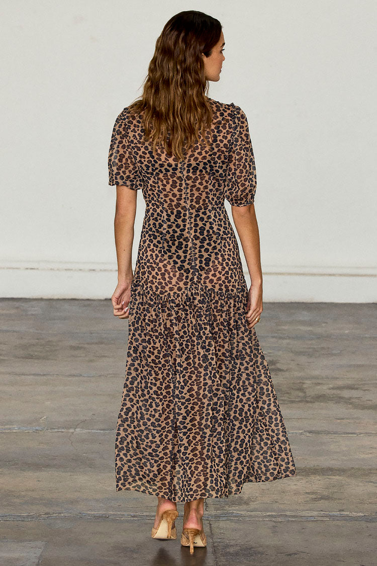 Leopard Lucia Dress in sheer animal print with puff sleeves and a tiered skirt, shown from the back.