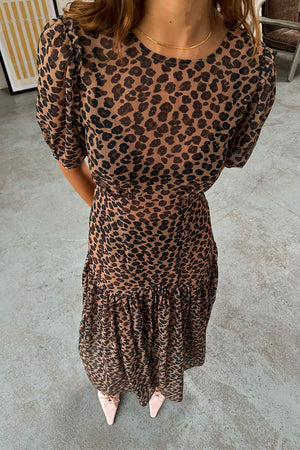 Sheer Leopard Lucia Dress featuring puff sleeves and a tiered skirt in an iconic leopard print.