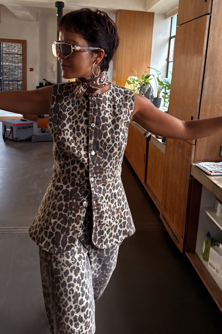 Iconic leopard waistcoat with metal buttons, styled as a co-ord with matching trousers and a neck scarf.