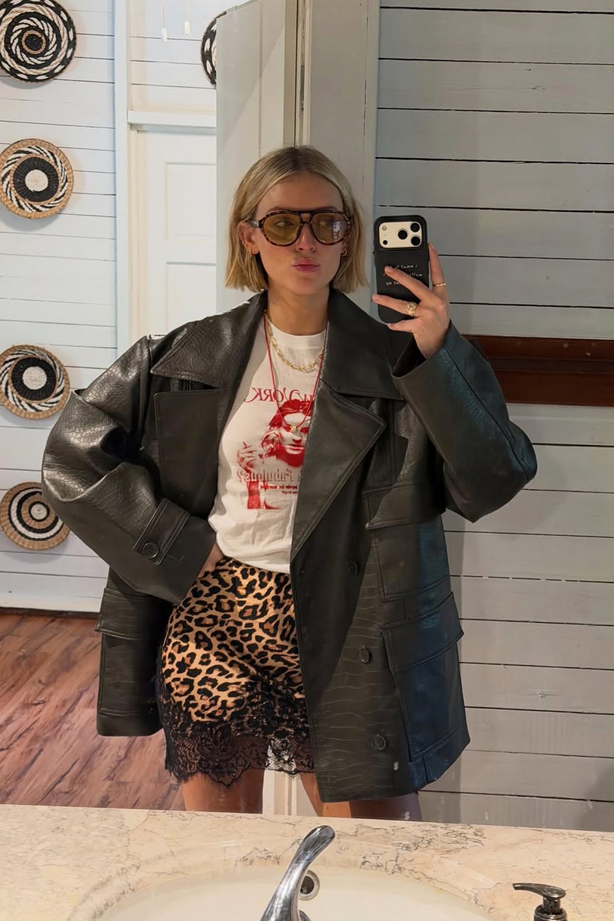 Leopard Lace Mini Maeva Skirt with a black lace border, styled with an oversized jacket and tee for a London look.