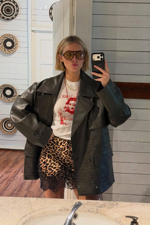 Leopard Lace Mini Maeva Skirt with a black lace border, styled with an oversized jacket and tee for a London look.