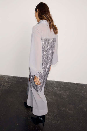 Gunmetal Sequin Lila Shirt Dress in grey, featuring a shimmering sequin back panel and relaxed longline silhouette.