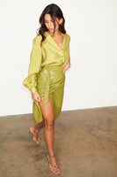 Thumbnail for model weaing Lime Miley Shirt & vegan leather skirt