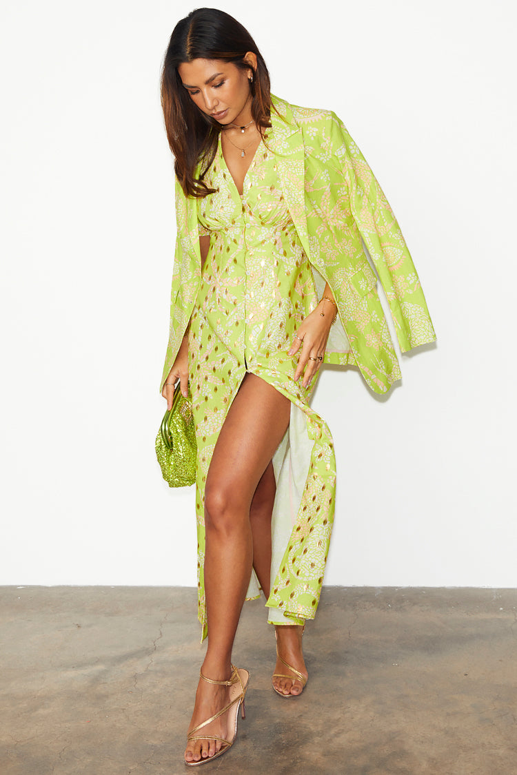 caption_Model wears Lime Mosaic Lindos Dress in UK size 10/ US 6