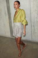 Thumbnail for model wearing Lime Miley Shirt & vegan leather skirt