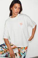 Thumbnail for caption_Model wears White Logo T-shirt in UK size 10/ US 6