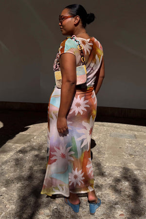 Abstract Soleil Luna Mesh Dress in a multicoloured sun print with a stretchy finish, styled on a curve model.