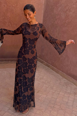 Tan Jaden Floral Mesh Dress with long flared sleeves and high neckline on a model.