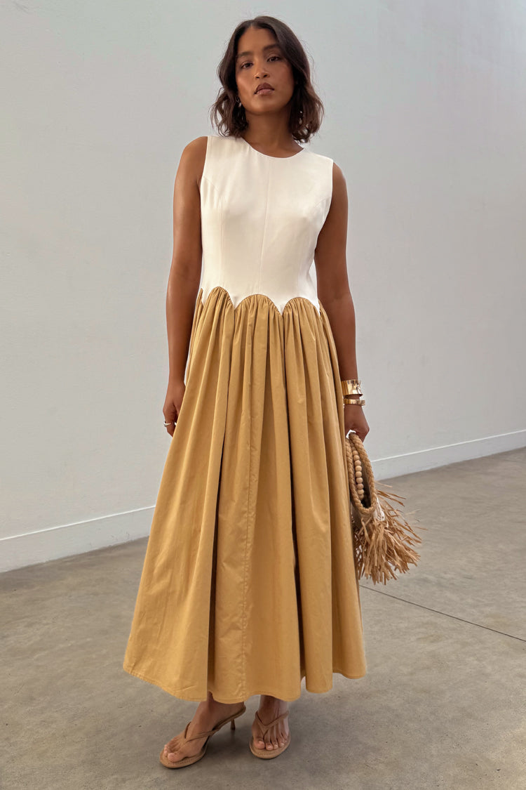 Camel Monika Dress with a panelled cream corset top, scalloped hem and a camel pleated cotton skirt.