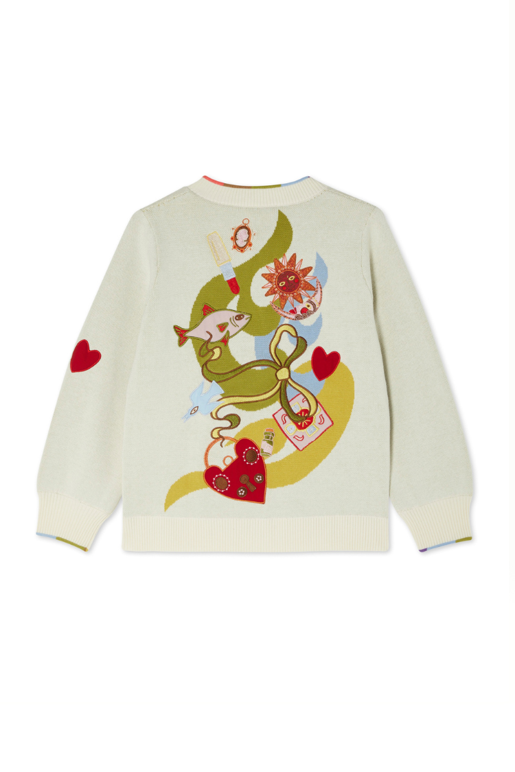 Cream Multi Enchanted Cardigan showing the back print with colourful sun, fish, bow, and heart motifs.