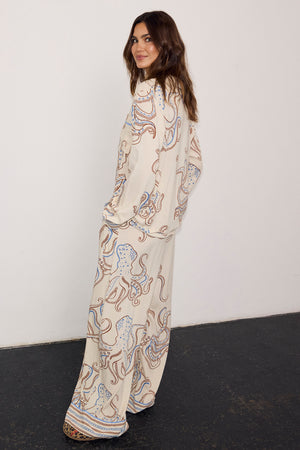 Cream Octopus Button Through Pyjamas featuring a blue and brown octopus print, styled in a relaxed fit on a model.